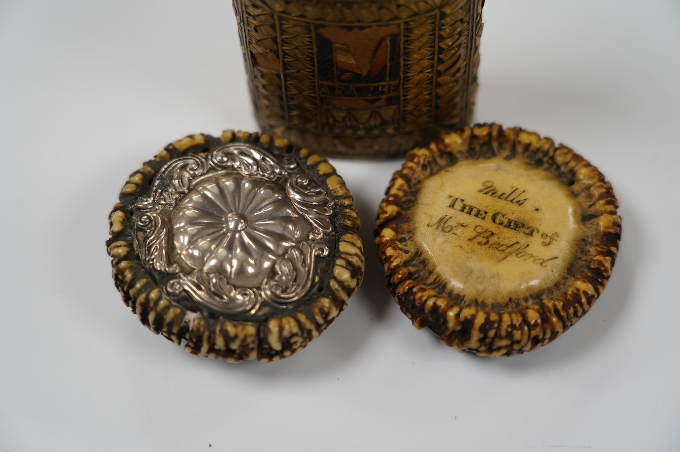 Two 19th century Scottish staghorn snuff boxes. one inscribed 'Mills, THE GIFT of Mr Bedford', with horn lid, 6.5cm, the other with white metal mounts, 6.5cm and a straw-work box, 8.5cm. Condition - staghorn boxes good,